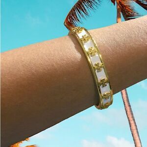 TORY BURCH LACQUERED RAISED KIRA LOGO STUDDED BRACELET